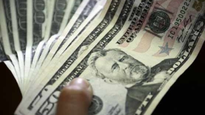 Dollar falls 1 percent after weak U.S