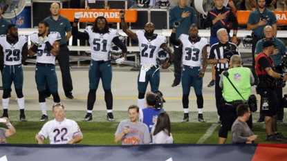 Eagles players raise fists during national anthem at Soldier Field