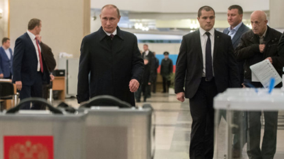 Is this a Putin faithful stuffing a ballot box with FAKE votes?