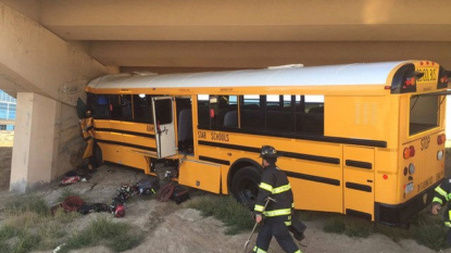 Driver killed, 18 injured in school bus crash at Denver airport