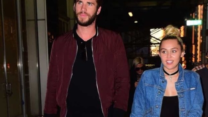 Miley Cyrus and Liam Hemsworth pack on the PDA