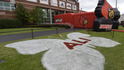 Louisville shows off chrome helmets with Muhammad Ali decal