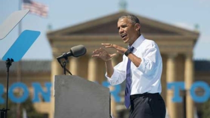 Obama hits at ‘unfair’ criticism of Clinton