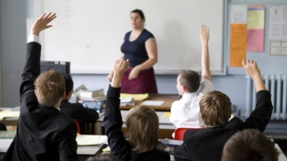 Theresa May says private schools must do more to keep tax breaks