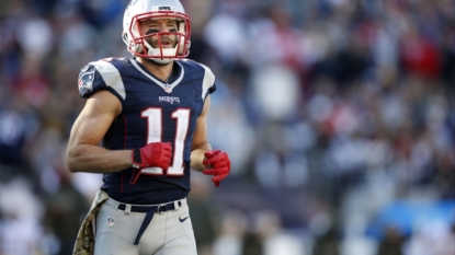 QB Jimmy Garoppolo gets the game ball during Patriots locker room celebration