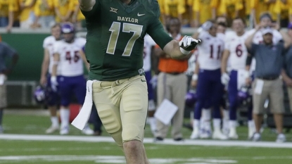 Russell 4 TD passes, No. 23 Baylor rolls 55-7 over Demons