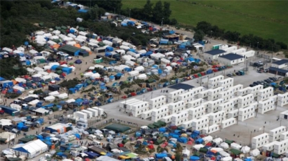 Lorry drivers downgrade blockade to go-slow as they protest against Calais camp