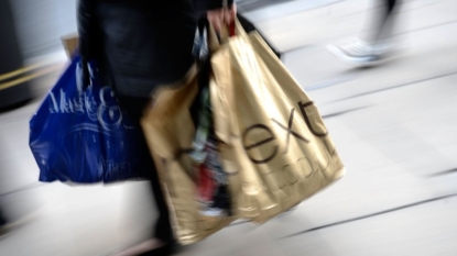 Next retail profits slide as consumers shun full-price clothes