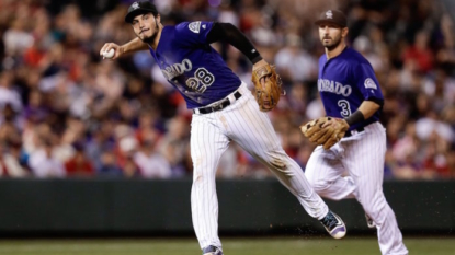 Wainwright drives in 4 as Cards beat Rockies 10-5