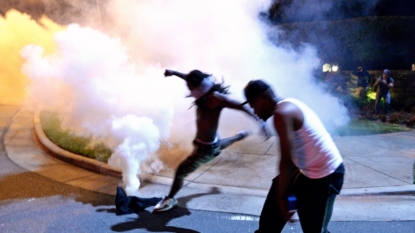 Watch a protester knock down a CNN reporter during unrest in Charlotte