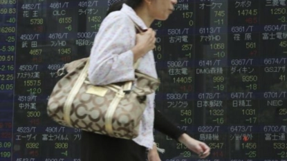 World stocks gain, dollar falls after Bank of Japan; eyes on Fed