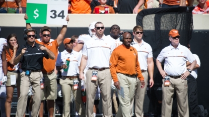 Charlie Strong takes over defense for Texas, demotes Bedford