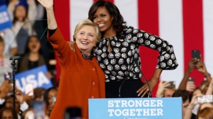 Clinton rallies with Mrs. Obama as Trump alleges corruption