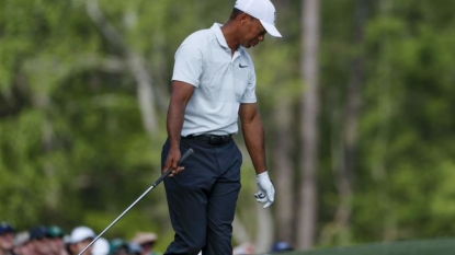 Masters updates: Umbrellas out as Woods begins his 3rd round