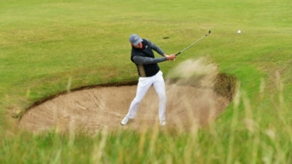 Tiger causes frenzy with third-round charge at British Open